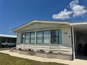 Charming home with great windows, pretty siding, and nice landscaping at 341 Outrigger Pl, North Port, FL 34287