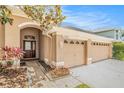 Inviting front entrance featuring a double-door entry and a two-car garage at 11924 Northumberland Dr, Tampa, FL 33626
