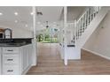 Bright and airy living room with wood floors and large windows overlooking the outdoors at 6317 Discovery Ln, Land O Lakes, FL 34638