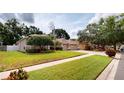 Beautiful single-story home featuring a manicured lawn and two-car garage at 4506 Gentrice Dr, Valrico, FL 33596