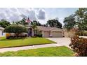 Beautiful single-story home featuring a manicured lawn and two-car garage at 4506 Gentrice Dr, Valrico, FL 33596