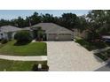 Beautiful home with a well-manicured lawn and a spacious driveway leading to a two-car garage at 4506 Gentrice Dr, Valrico, FL 33596