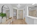 Inviting foyer with light wood floors, neutral walls, and ample natural light at 1103 Hardwood Dr, Valrico, FL 33596