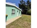 A view of the exterior featuring a grassy lawn at 21077 Gertrude Ave, Port Charlotte, FL 33952
