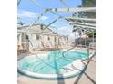 Enclosed pool with clear water and surrounding patio offers a private outdoor oasis for leisure at 3620 E Tampa Cir, Tampa, FL 33629