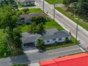 Overhead perspective of a home with a detached garage, highlighting the property's overall dimensions and positioning at 602 E Laura St, Plant City, FL 33563
