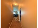 Hallway leading into living space with neutral walls at 13443 Graham Yarden Dr, Riverview, FL 33579