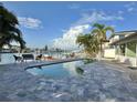 Inviting waterfront pool with a patio area perfect for relaxation and enjoying water views at 320 Palm Ne Is, Clearwater Beach, FL 33767