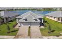 Two-story home with lake view and paver driveway at 18039 Cherished Loop, Bradenton, FL 34211
