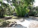Gray house with bamboo and lush landscaping at 1480 17Th St, Sarasota, FL 34234