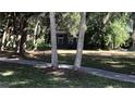 Dark gray house, partially obscured by trees at 1480 17Th St, Sarasota, FL 34234