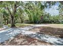 Dark gray house with large windows and lush yard at 1480 17Th St, Sarasota, FL 34234