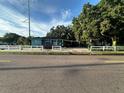 Charming teal house with a carport and a white picket fence at 2415 E 21St Ave, Tampa, FL 33605