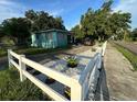 Front yard with white fence and landscaping at 2415 E 21St Ave, Tampa, FL 33605