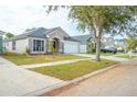 House exterior featuring a front yard with landscaping at 11519 Misty Isle Ln, Riverview, FL 33579
