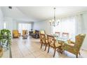 Bright dining area with glass-top table and seating for four at 11519 Misty Isle Ln, Riverview, FL 33579