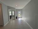 Bright entryway with tile flooring and a view to a room with French doors at 3522 N Maryland Ave, Plant City, FL 33565