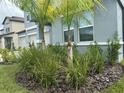 Landscaped front yard of a home with well manicured plants and grass at 3522 N Maryland Ave, Plant City, FL 33565