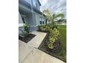 Home exterior showing sidewalk with a nicely landscaped yard at 3522 N Maryland Ave, Plant City, FL 33565