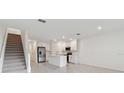 A bright kitchen with stainless steel appliances, white cabinetry and island at 5425 Tripoli Dr, Palmetto, FL 34221