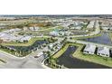 An aerial view showcases the neighborhood layout, lakes, and recreational amenities in the community at 17220 Savory Mist Cir, Bradenton, FL 34211