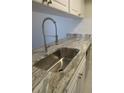 The kitchen sink shows off a stainless steel sink, modern faucet, and countertop at 3102 W Horatio St # 12, Tampa, FL 33609