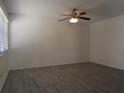 A bright bedroom featuring modern ceiling fan, flooring, and a window with natural light at 3102 W Horatio St # 21, Tampa, FL 33609