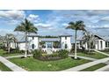 Elegant pool entrance flanked by palm trees and lush landscaping, creating a serene resort-like atmosphere at 17224 Savory Mist Cir, Bradenton, FL 34211