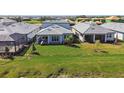 The backyard has a green lawn, covered patio and great neighborhood views at 17245 Savory Mist Cir, Bradenton, FL 34211