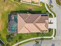 Stunning overhead view of a home featuring a pool, screened lanai, and beautifully landscaped yard at 5599 Hidden Oak Ct, North Port, FL 34287