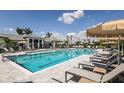 Beautiful community swimming pool with lounge chairs and resort-style amenities at 18068 Cherished Loop, Bradenton, FL 34211