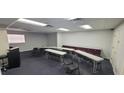 Workspace featuring rows of tables, chairs, and a storage unit at 227 Central Ave, Sarasota, FL 34236