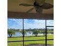 Enjoy scenic water views from this screened lanai with a ceiling fan and black aluminum screen at 227 Heritage Preserve Run, Bradenton, FL 34212