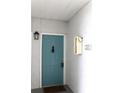 Charming condo front door with blue finish, black hardware, and unit number 201 at 5613 Legacy Crescent Pl # 201, Riverview, FL 33578