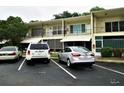 Exterior of condo building with parking spaces at 4154 57Th N St # 272, Kenneth City, FL 33709
