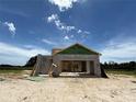 This is the construction of a modern home with the block and ZIP System sheathing in the early framing stages at 7930 Chandler Lake Ct, Hudson, FL 34667