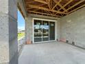 Concrete patio featuring a large sliding glass door, offering an indoor-outdoor experience at 7979 Chandler Lake Ct, Hudson, FL 34667
