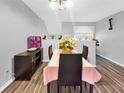 Dining room with a table, chairs, and a pink tablecloth at 304 34Th Avenue E Dr # 304, Bradenton, FL 34208