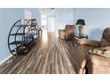 Bright living room featuring a wood-look floor and comfy seating at 304 34Th Avenue E Dr # 304, Bradenton, FL 34208
