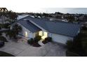 Single-story home with a metal roof and landscaped yard at 975 Coronado Dr, Punta Gorda, FL 33950