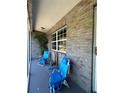 Cozy screened porch with comfortable seating and views of the garden at 40610 State Road 64 E, Myakka City, FL 34251