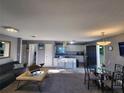 Open living room and kitchen with modern appliances and a dining area at 2309 22Nd W Ave, Bradenton, FL 34205