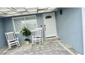 Inviting front entrance with a white door, and a welcome mat at 4229 Floramar Ter, New Port Richey, FL 34652