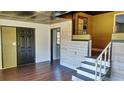 Home entryway with stairs to a loft and dark door at 406 E Young St, Plant City, FL 33563