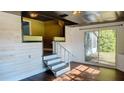 Loft area with built-in seating, stairs, and wood-like wall at 406 E Young St, Plant City, FL 33563