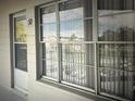 Exterior view of a condo building with a door and windows at 2070 World Parkway Blvd # 50, Clearwater, FL 33763