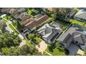 Aerial view of houses in a residential neighborhood with pools at 2228 Valrico Forest Dr, Valrico, FL 33594