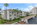 Exterior view of a condo building with parking and a patio area at 2725 Terra Ceia Bay Blvd # 201, Palmetto, FL 34221