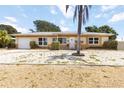 Charming single-story home featuring a front lawn and a concrete driveway at 1801 40Th N St, St Petersburg, FL 33713
