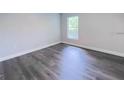 Bright bedroom with gray vinyl plank flooring at 13435 Kaplan Ter, Port Charlotte, FL 33981